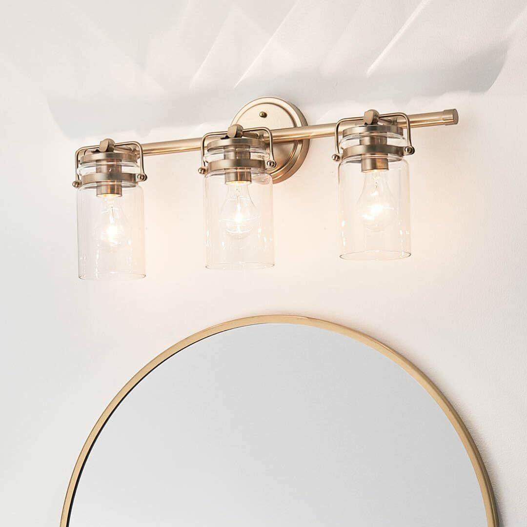 Kichler, Brinley 24" 3 Light Vanity Light with Clear Glass in Champagne Bronze,