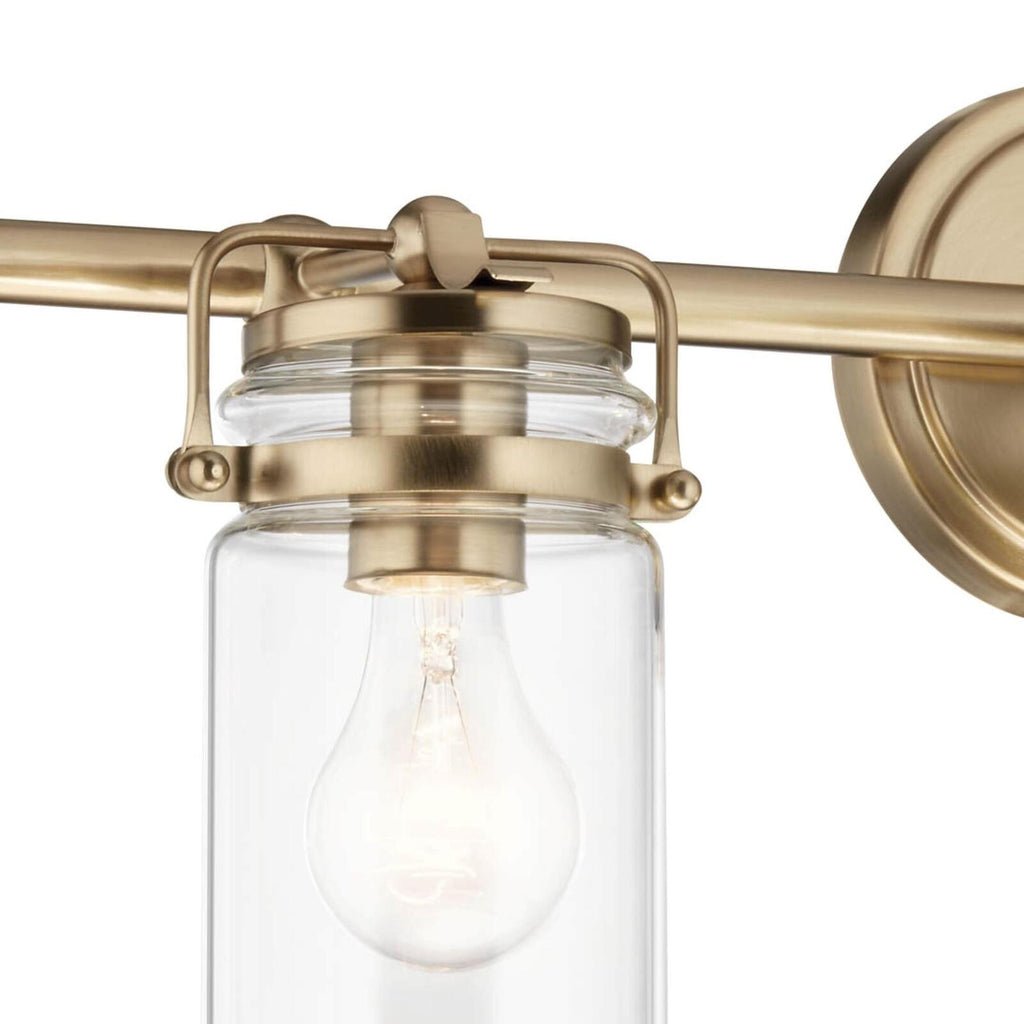 Kichler, Brinley 24" 3 Light Vanity Light with Clear Glass in Champagne Bronze,