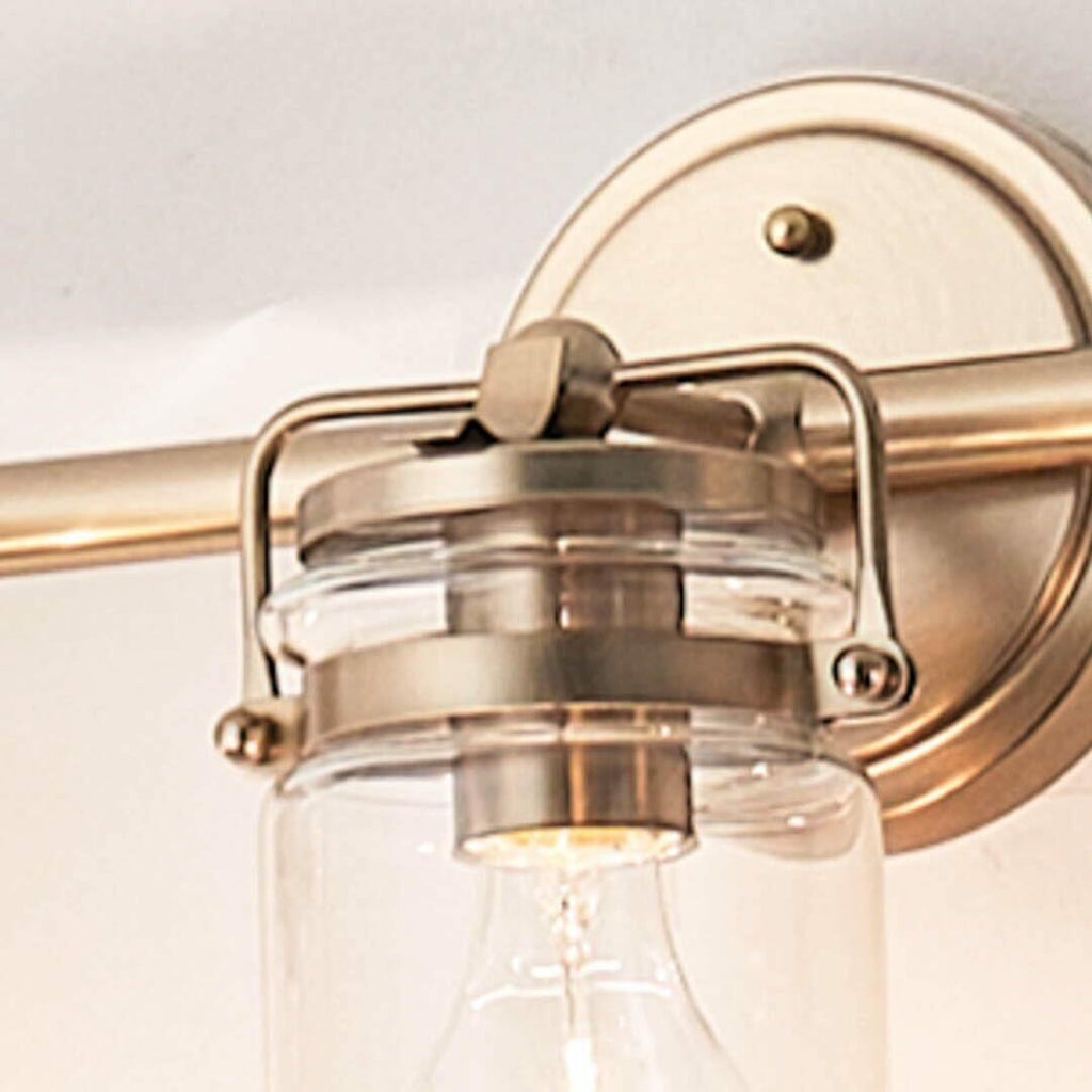 Kichler, Brinley 24" 3 Light Vanity Light with Clear Glass in Champagne Bronze,