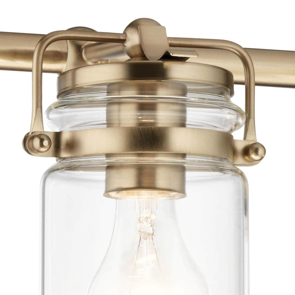 Kichler, Brinley 24" 3 Light Vanity Light with Clear Glass in Champagne Bronze,