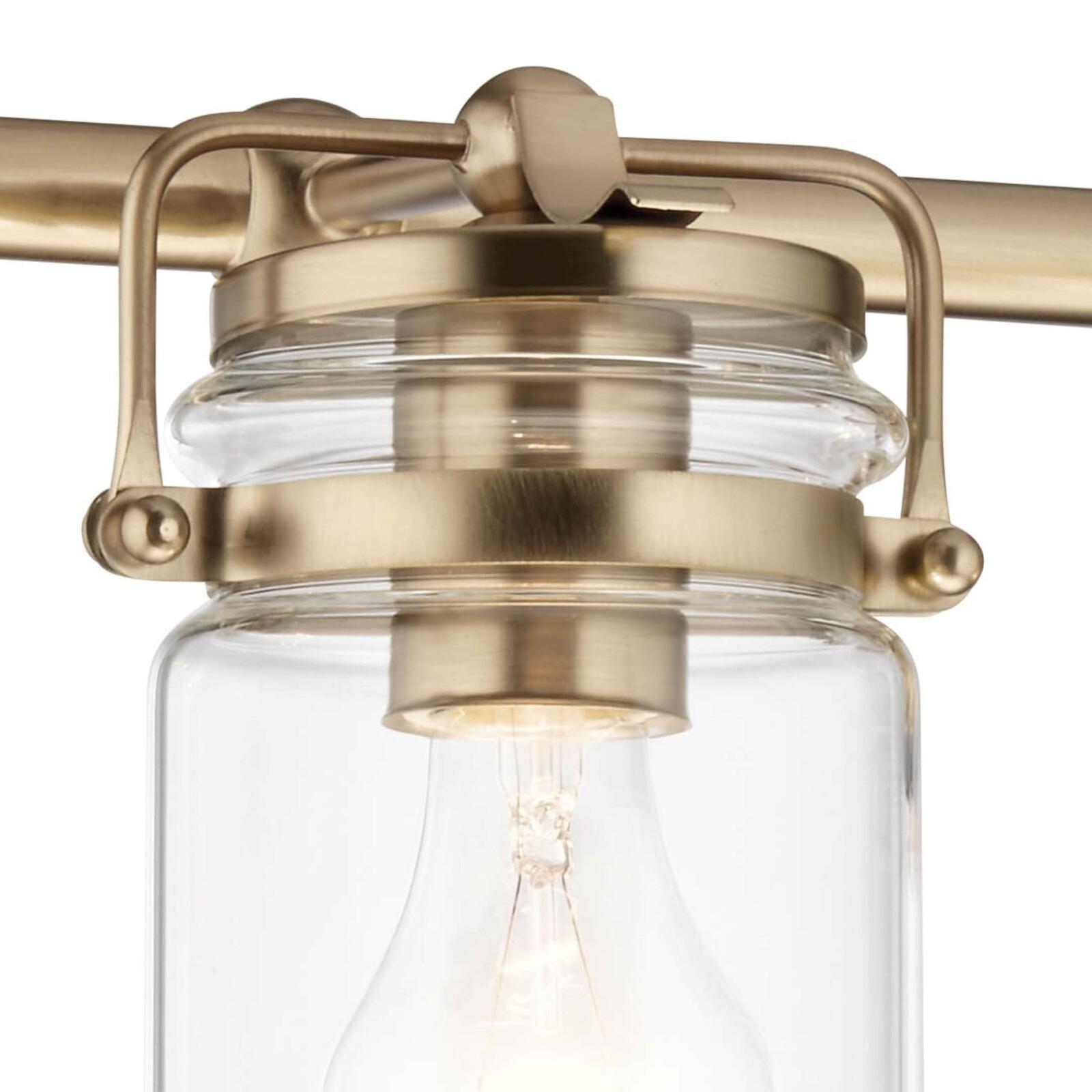 Kichler, Brinley 24" 3 Light Vanity Light with Clear Glass in Champagne Bronze,